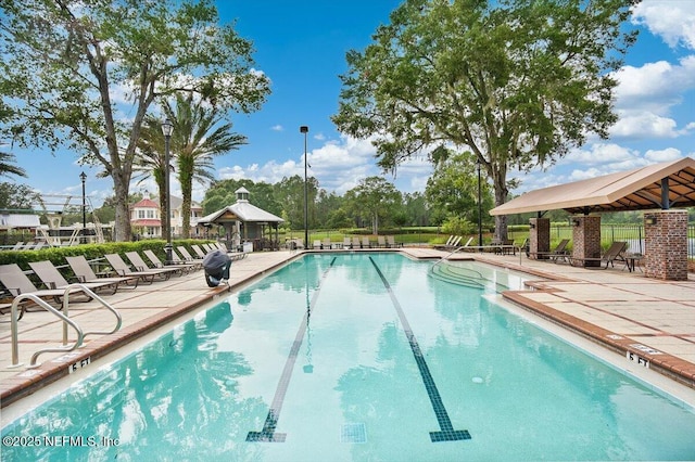 982 Oakland Hills Ave, Middleburg, FL 32068 - community pool featuring a gazebo, a patio area, and fence