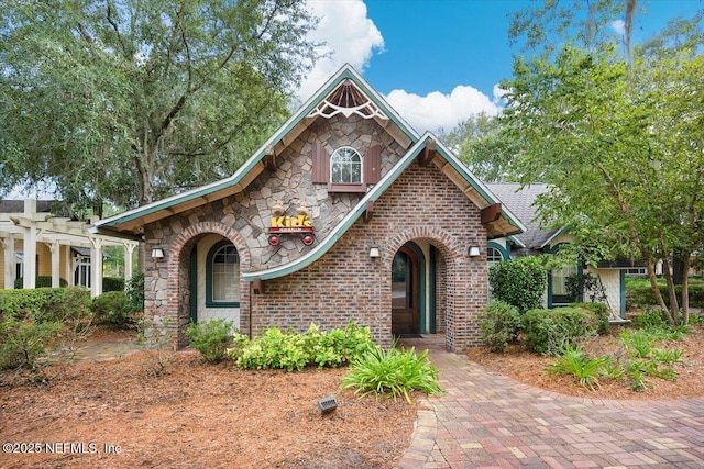 982 Oakland Hills Ave, Middleburg, FL 32068 - view of front of house with brick siding, a pergola, and stone siding