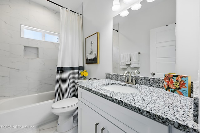 bathroom featuring vanity, marble finish floor, toilet, and shower / tub combo