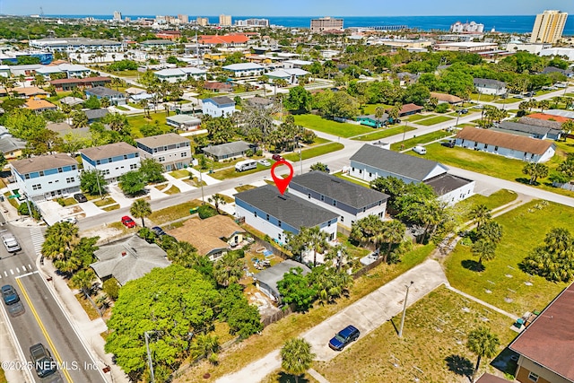 birds eye view of property with a water view and a residential view