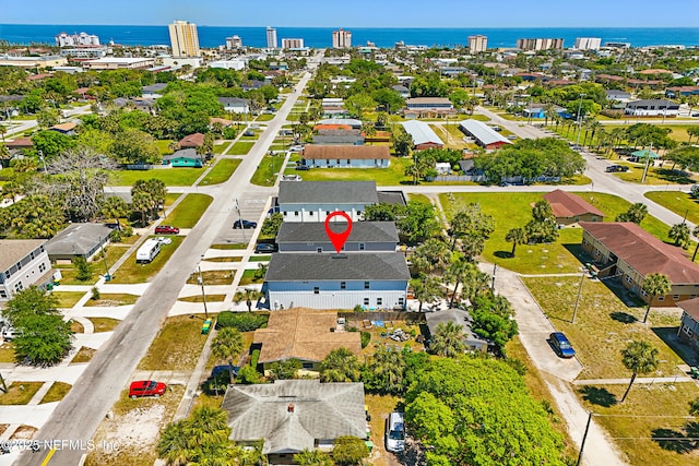 bird's eye view featuring a residential view and a water view