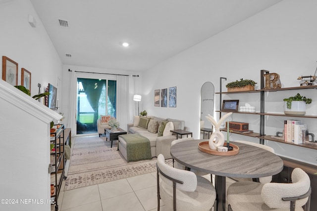 living room featuring visible vents, light tile patterned floors, and recessed lighting