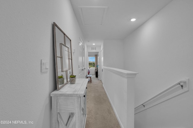 hall featuring recessed lighting, light colored carpet, attic access, an upstairs landing, and visible vents