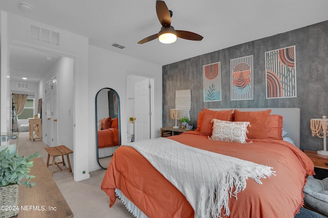 bedroom with visible vents, ceiling fan, and carpet flooring