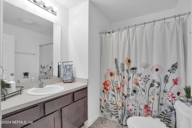 full bath with curtained shower, toilet, vanity, and marble finish floor