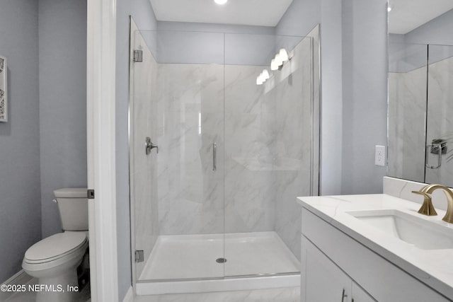 full bathroom with a marble finish shower, toilet, and vanity
