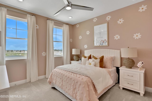 bedroom with baseboards, a ceiling fan, light carpet, and recessed lighting