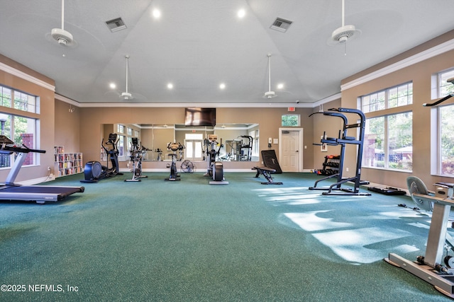 gym with recessed lighting, visible vents, ornamental molding, and plenty of natural light