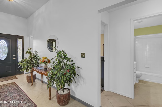 1558 Roseberry Ct, Fleming Island, FL 32003 - entrance foyer featuring light tile patterned floors and baseboards