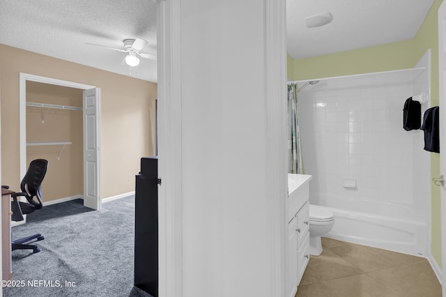 1558 Roseberry Ct, Fleming Island, FL 32003 - bathroom featuring shower / bath combo, toilet, baseboards, a ceiling fan, and a textured ceiling