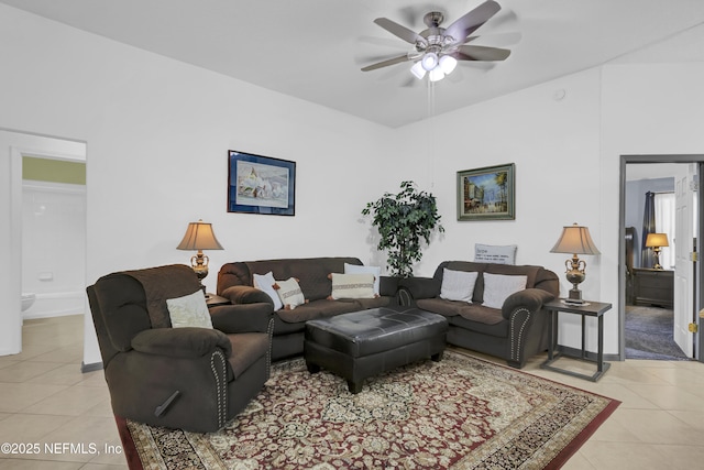 1558 Roseberry Ct, Fleming Island, FL 32003 - living room featuring light tile patterned floors, ceiling fan, and baseboards