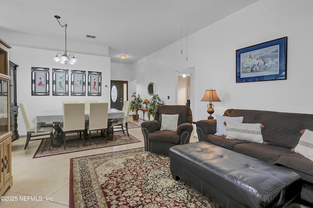 1558 Roseberry Ct, Fleming Island, FL 32003 - living area featuring light tile patterned floors, visible vents, and a notable chandelier