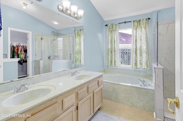 1558 Roseberry Ct, Fleming Island, FL 32003 - bathroom with a garden tub, a sink, tiled shower, and lofted ceiling