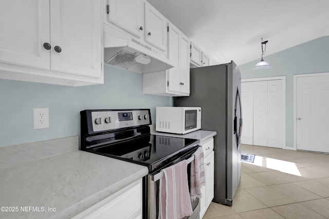 1558 Roseberry Ct, Fleming Island, FL 32003 - kitchen with under cabinet range hood, stainless steel electric range, light tile patterned floors, white microwave, and white cabinets