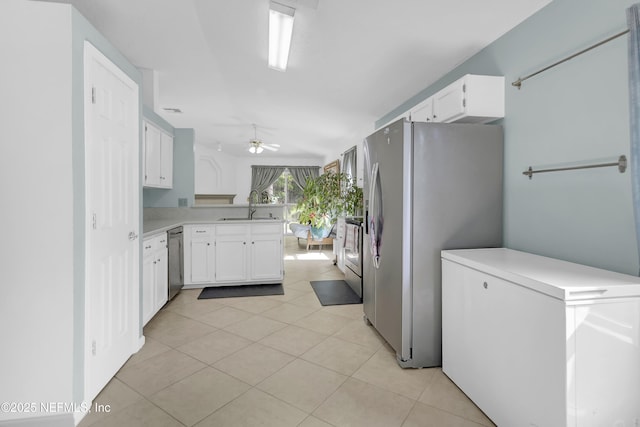 1558 Roseberry Ct, Fleming Island, FL 32003 - kitchen with light tile patterned floors, a sink, appliances with stainless steel finishes, light countertops, and a ceiling fan