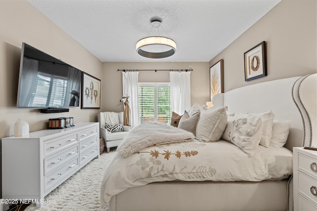 1576 Linkside Dr, Fleming Island, FL 32003 - bedroom featuring a textured ceiling and light colored carpet