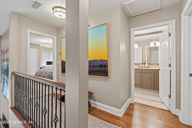 1576 Linkside Dr, Fleming Island, FL 32003 - hall with light wood-style floors and baseboards