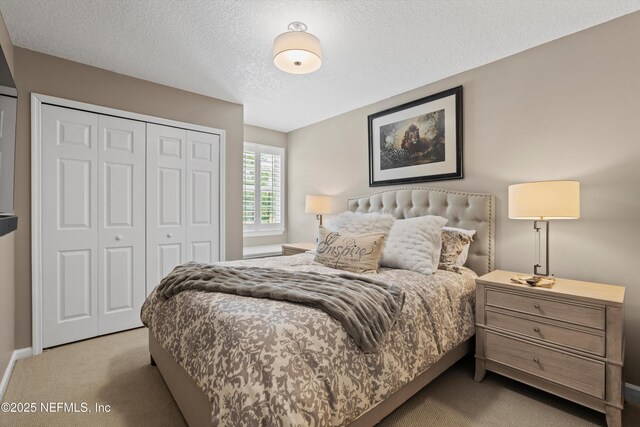 1576 Linkside Dr, Fleming Island, FL 32003 - carpeted bedroom featuring a closet, a textured ceiling, and baseboards