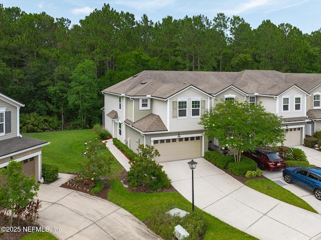 133 San Briso Way, Saint Augustine, FL 32092 - traditional-style home featuring a garage, concrete driveway, a front yard, and roof with shingles