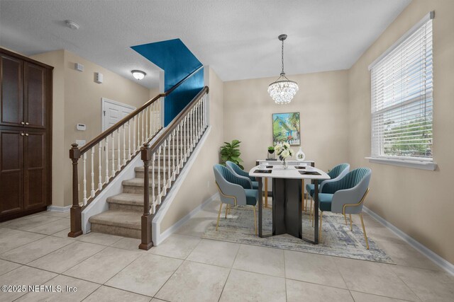 133 San Briso Way, Saint Augustine, FL 32092 - dining area with stairway, a chandelier, and light tile patterned flooring