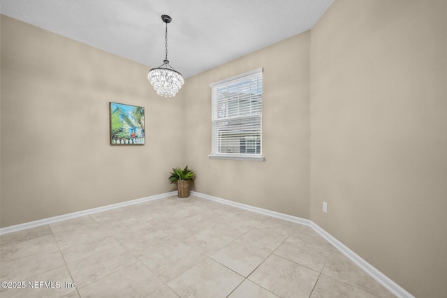 133 San Briso Way, Saint Augustine, FL 32092 - spare room featuring a chandelier and light tile patterned flooring