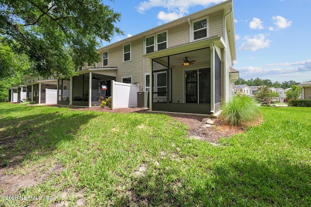 133 San Briso Way, Saint Augustine, FL 32092 - back of property with a sunroom, a ceiling fan, and a lawn