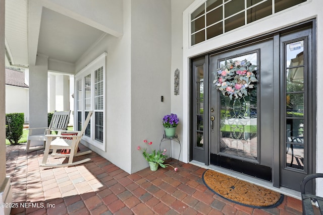 2427 Green Glade Ct, Fleming Island, FL 32003 - entrance to property featuring stucco siding and a porch