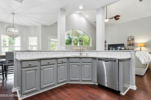 2427 Green Glade Ct, Fleming Island, FL 32003 - kitchen with dishwasher, gray cabinetry, a sink, vaulted ceiling, and a chandelier