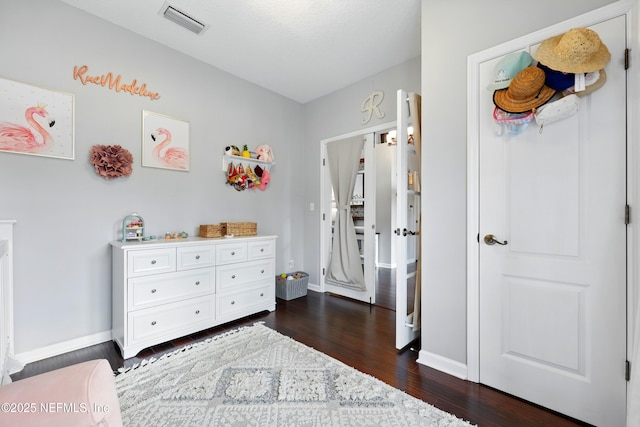 2427 Green Glade Ct, Fleming Island, FL 32003 - bedroom with dark wood finished floors and baseboards