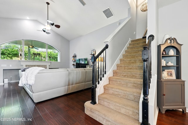 2427 Green Glade Ct, Fleming Island, FL 32003 - living room with a ceiling fan, lofted ceiling, stairway, and dark wood-type flooring