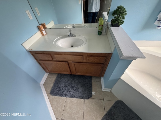bathroom featuring tile patterned flooring and vanity