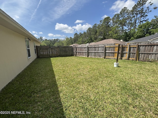 view of yard featuring a fenced backyard