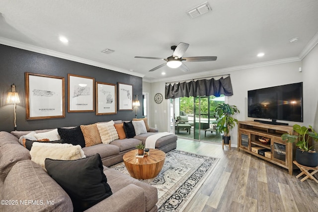 living room featuring recessed lighting, ceiling fan, visible vents, and wood finished floors