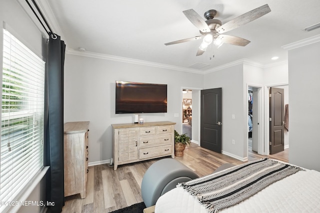 bedroom with ornamental molding and light wood-style flooring