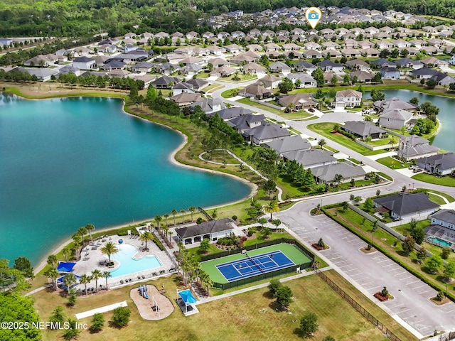 aerial view featuring a water view and a residential view