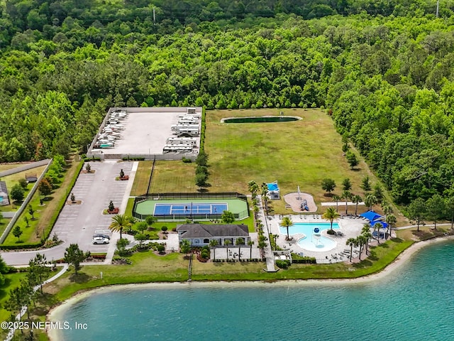 aerial view featuring a view of trees and a water view