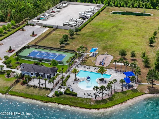 birds eye view of property featuring a water view