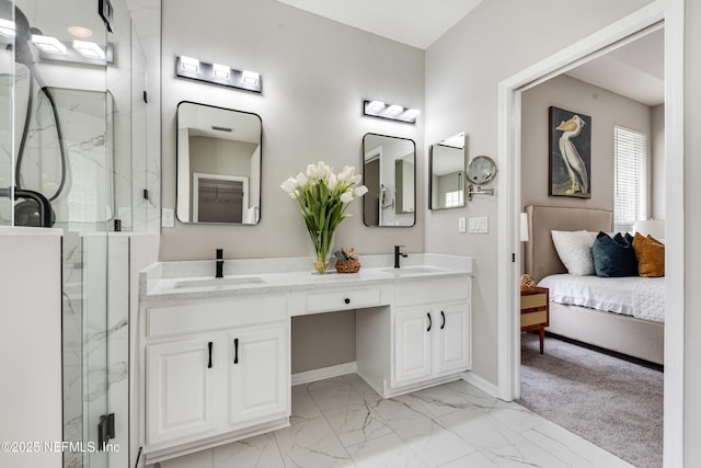 bathroom featuring a marble finish shower, a sink, and marble finish floor