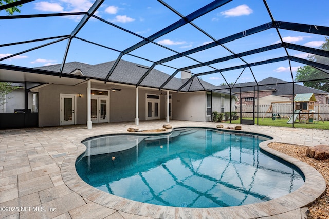 outdoor pool with a patio, a ceiling fan, french doors, and fence