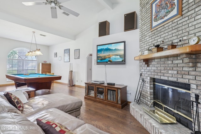living room featuring billiards, beamed ceiling, ceiling fan, visible vents, and wood finished floors