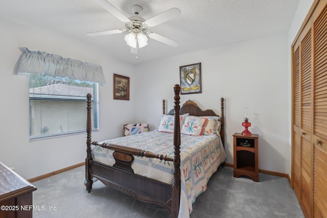 bedroom featuring a textured ceiling, ceiling fan, baseboards, a closet, and carpet