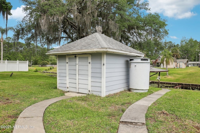 view of shed with fence