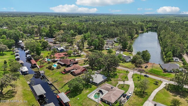 bird's eye view featuring a water view, a residential view, and a forest view