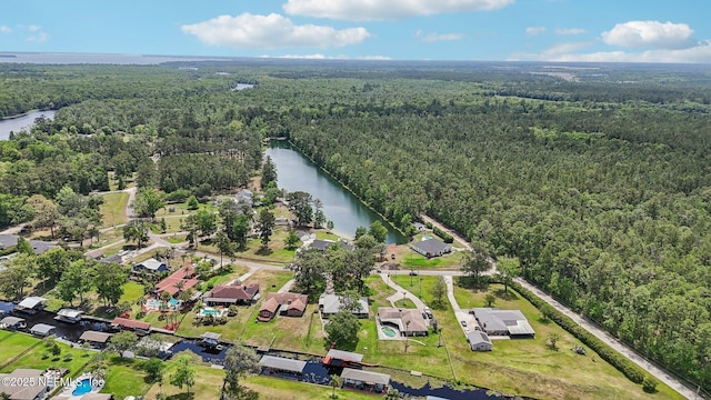 bird's eye view featuring a water view and a view of trees