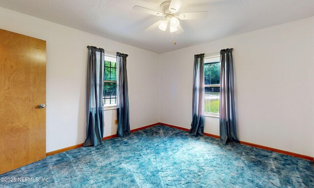 4041 Saddlehorn Trl, Middleburg, FL 32068 - empty room with healthy amount of natural light, carpet, ceiling fan, and baseboards