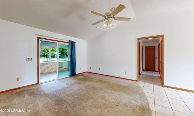 4041 Saddlehorn Trl, Middleburg, FL 32068 - empty room with lofted ceiling, baseboards, ceiling fan, light tile patterned floors, and light colored carpet