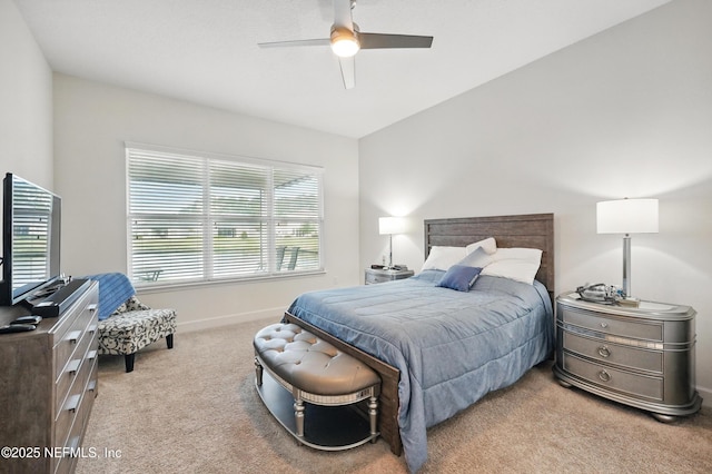 carpeted bedroom featuring a ceiling fan and baseboards