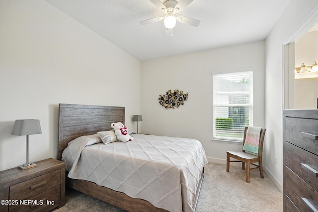 carpeted bedroom with baseboards and a ceiling fan