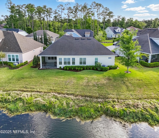 aerial view with a residential view and a water view