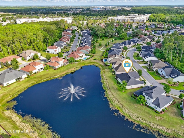 birds eye view of property with a residential view and a water view